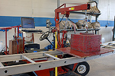 A ground ladder undergoing a horizontal bend test.